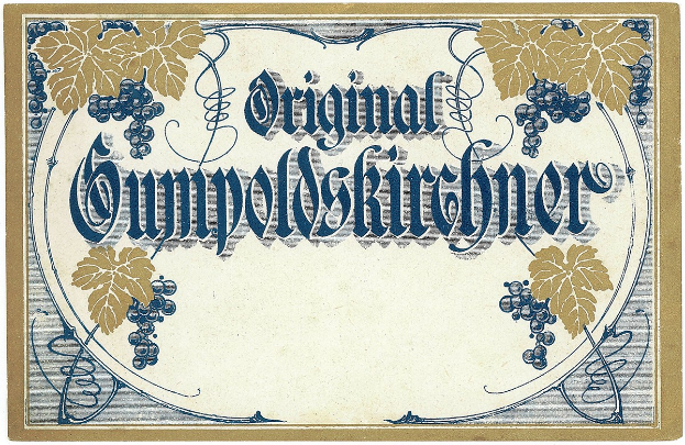 Ein altes deutsches Weinetikett mit einer Illustration von Trauben und Blättern und einem Text, der den Weintyp angibt.