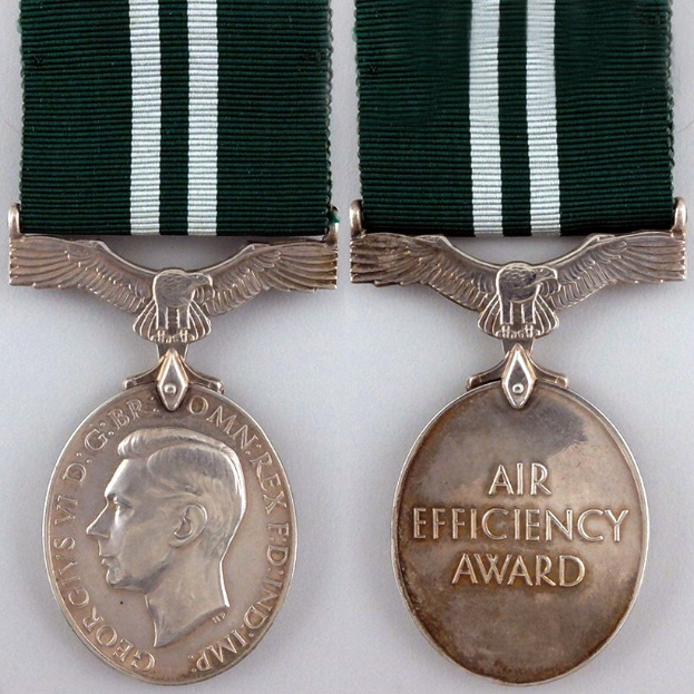 Two medals with green and white ribbons; one displays a portrait, the other reads "Air Efficiency Award".