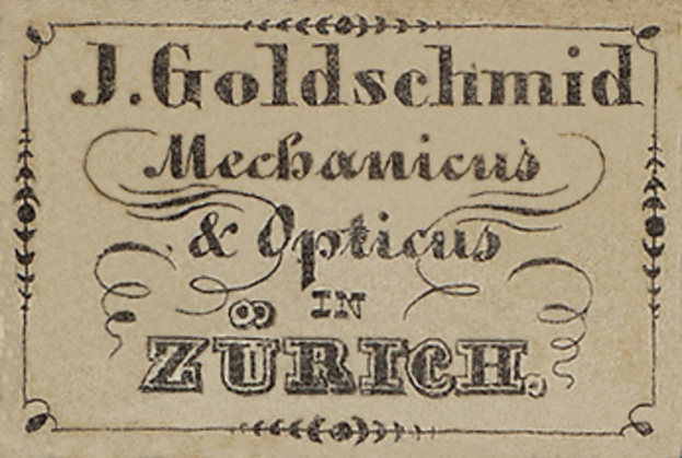 Eine alte Visitenkarte mit der Aufschrift "J. Goldschmidt Mechanicus & Optics in Zurich", wahrscheinlich aus dem frühen 20. Jahrhundert.