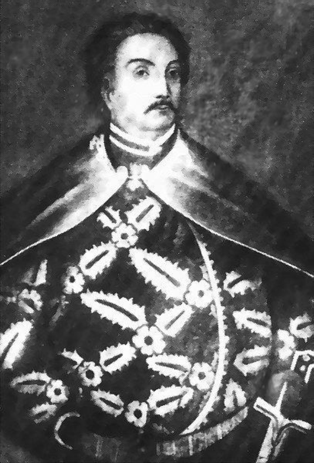 Schwarzes und weißes Foto von Papst Johannes Paul II. in Priesterroben, der eine schwarze Robe mit weißem Kragen und Manschetten trägt und seine Hände falt, mit einem strengen Gesichtsausdruck und direktem Blick.