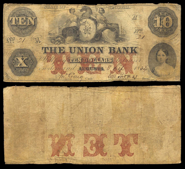 Alte Zehn-Dollar-Note der Union Bank aus dem Jahr 1862 mit einem Porträt einer Frau in einem Kleid mit einem Dutt, ernster Gesichtsausdruck, auf einem schwarzen Hintergrund mit großer weißer "Union Bank"-Schrift.